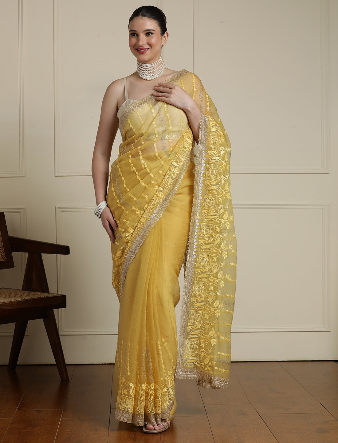 Women Ethnic Motifs Embroidered Saree in Yellow