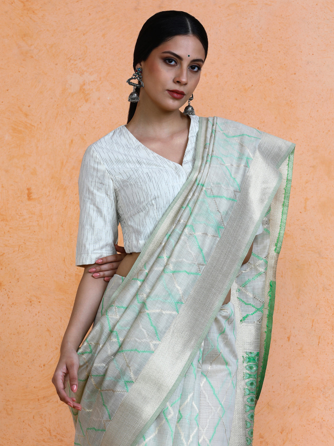 Devi Cotton in Beige with Green Motifs