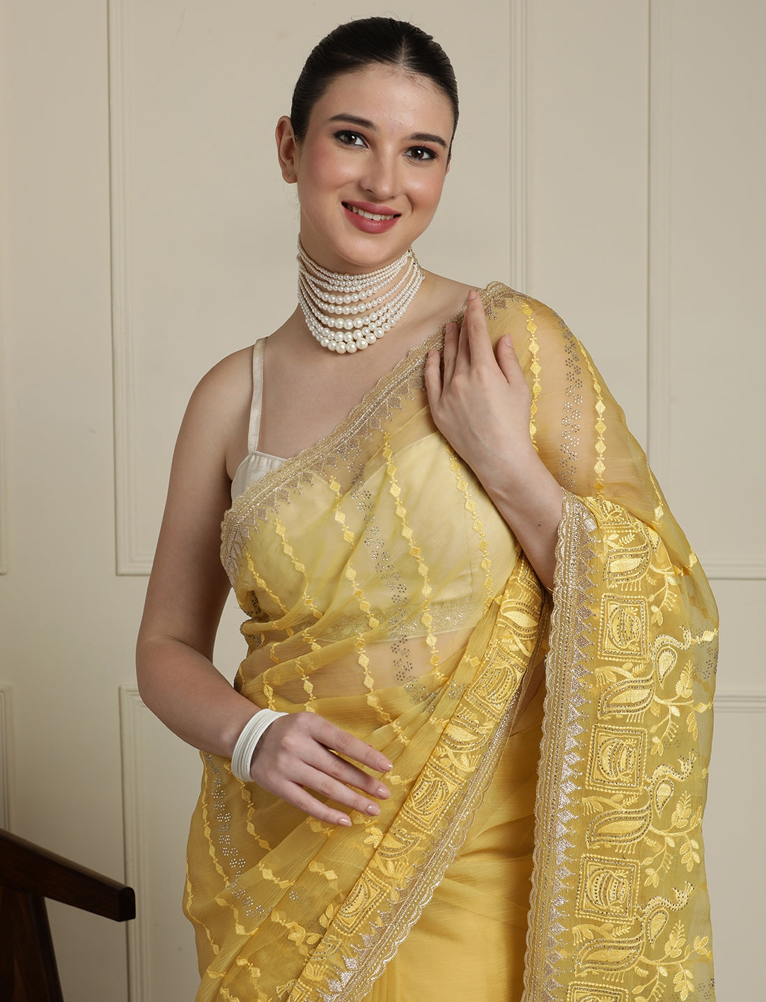 Women Ethnic Motifs Embroidered Saree in Yellow