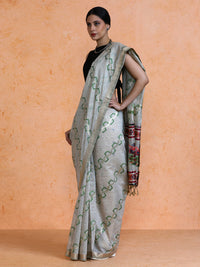 Devina Cotton in Beige with Green Motifs