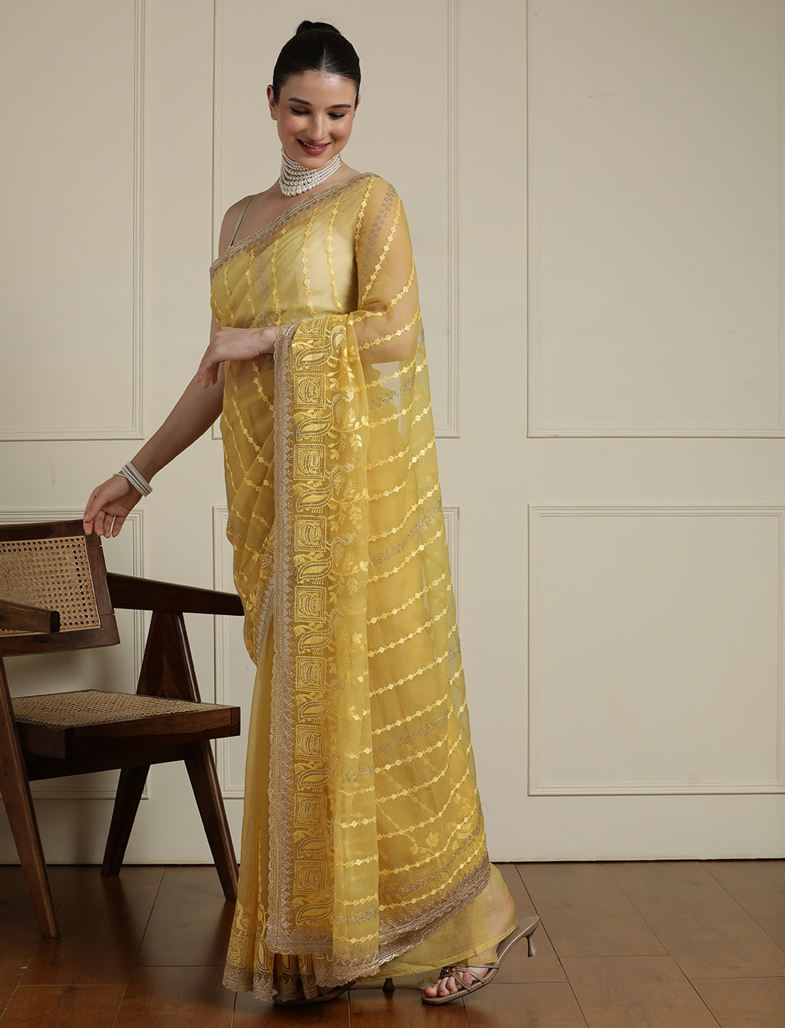Women Ethnic Motifs Embroidered Saree in Yellow